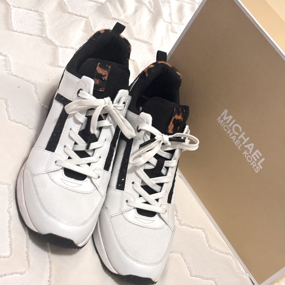 Micheal kors wedge leopard sneakers. Gently used. Worn twice. Smoke free home.